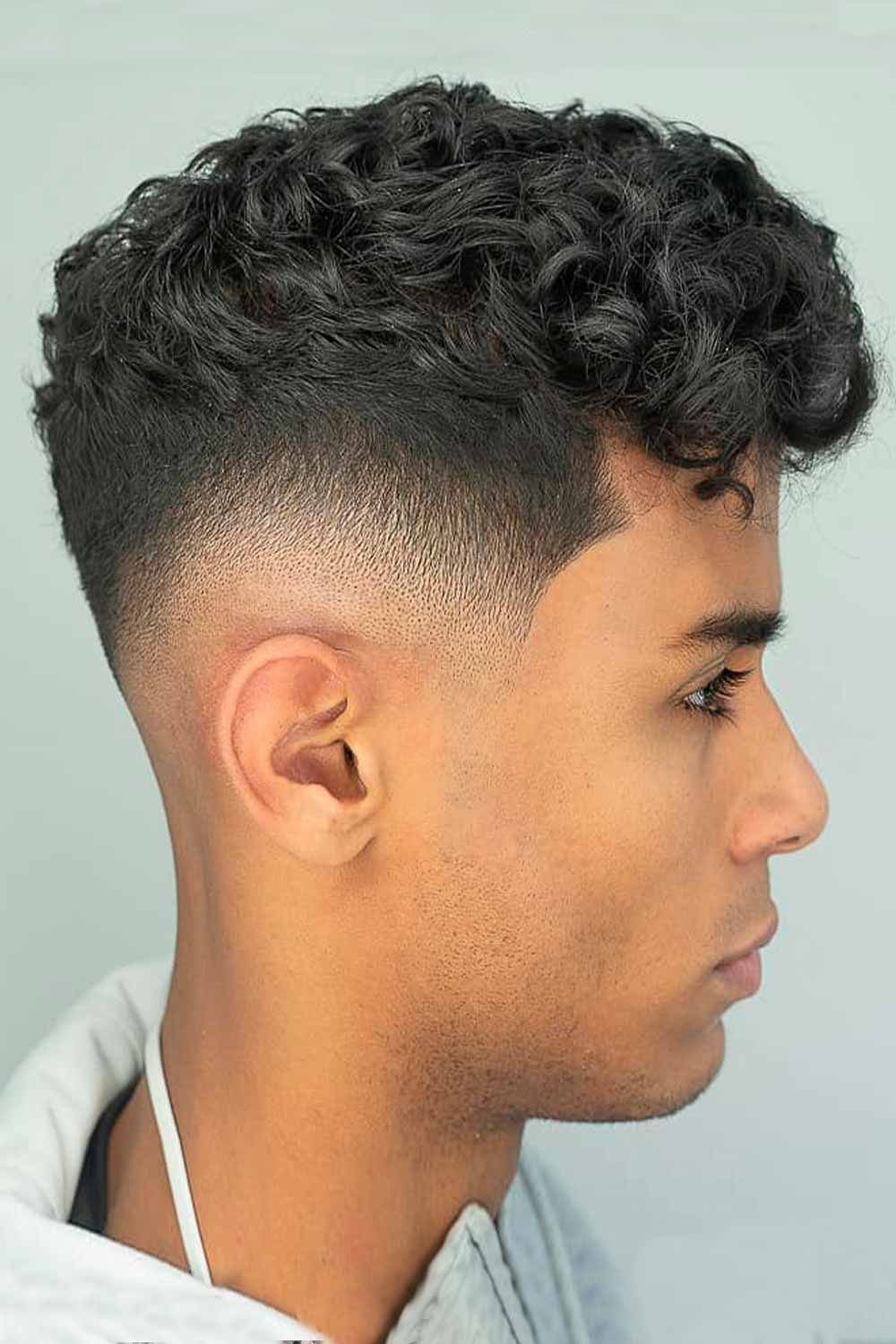 80 Men Hairstyles For Round Face-Dense Curled Top with Drop Fade
